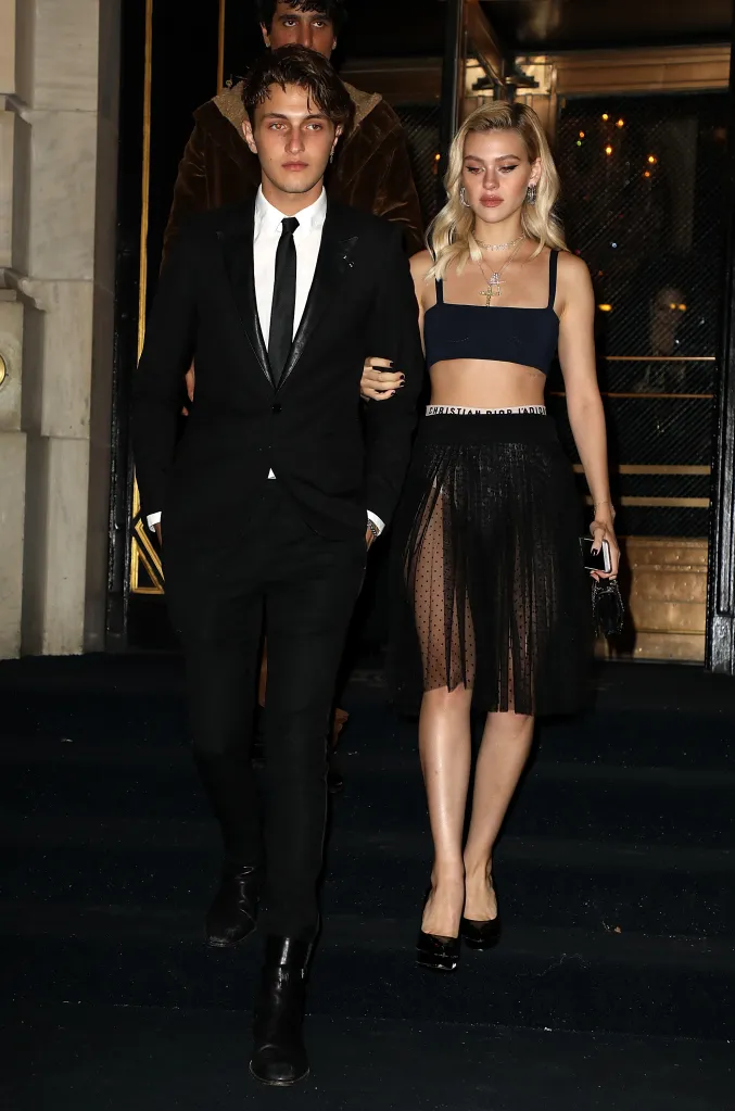 Anwar Hadid and Nicola Peltz arriving at an event.