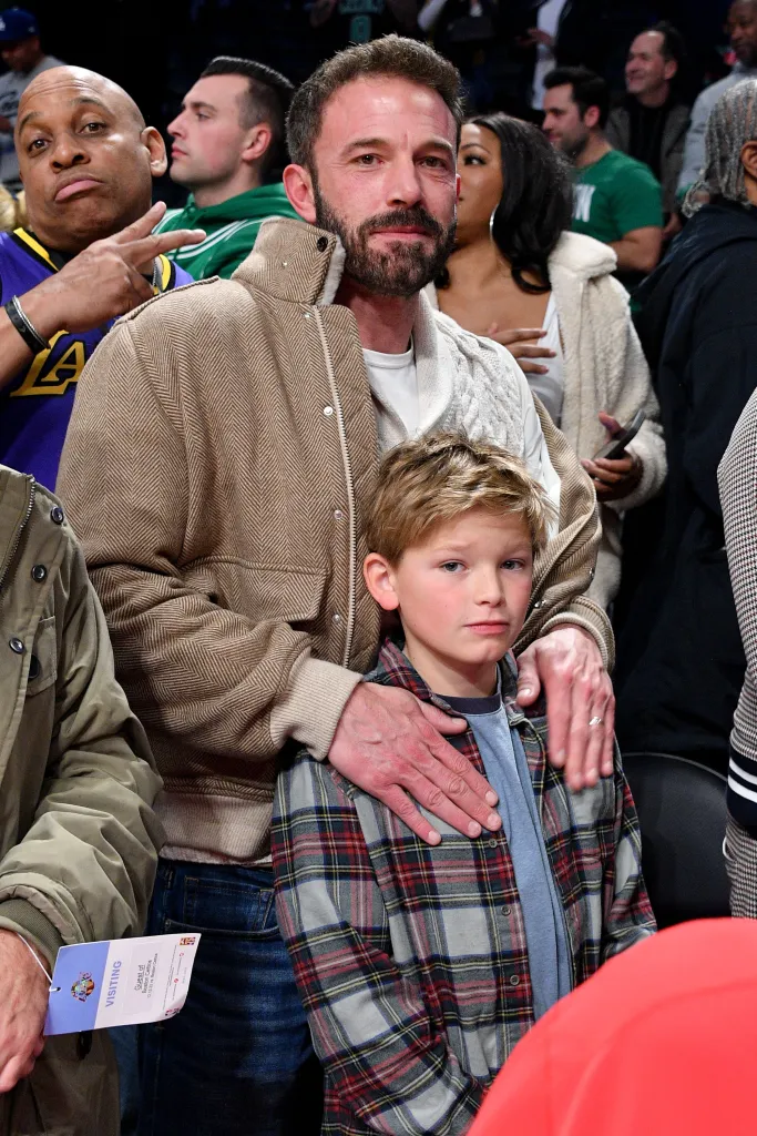 Ben Affleck and his son Samuel Garner Affleck at a Lakers vs Celtics basketball game.