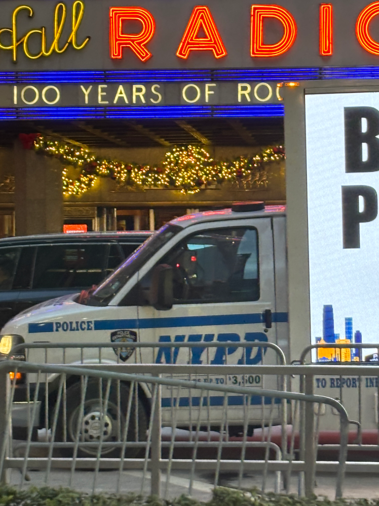 Billboard in front of Radio City warning people to be cautious of pickpockets.