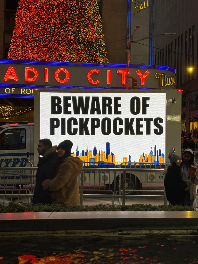 A billboard in front of Radio City Music Hall reads