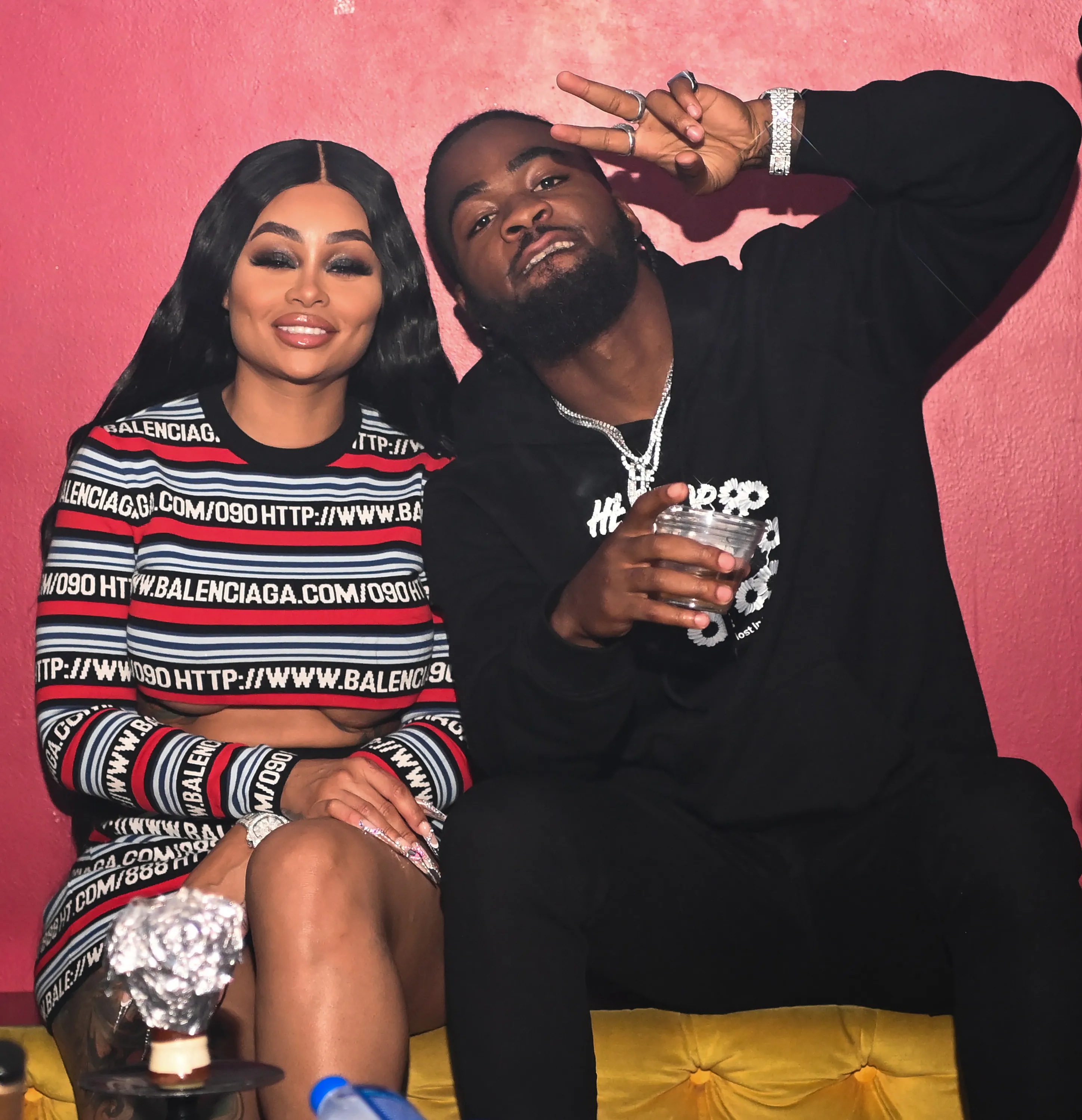 Blac Chyna and Lil Twin posing together.