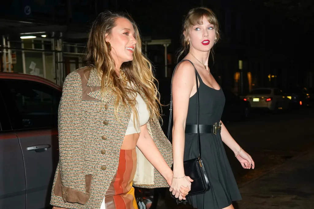 Blake Lively and Taylor Swift walking together at night in New York City.