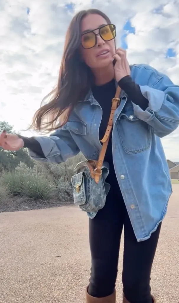 Bristol Palin wearing yellow sunglasses and an oversized denim jacket over a black top and leggings.