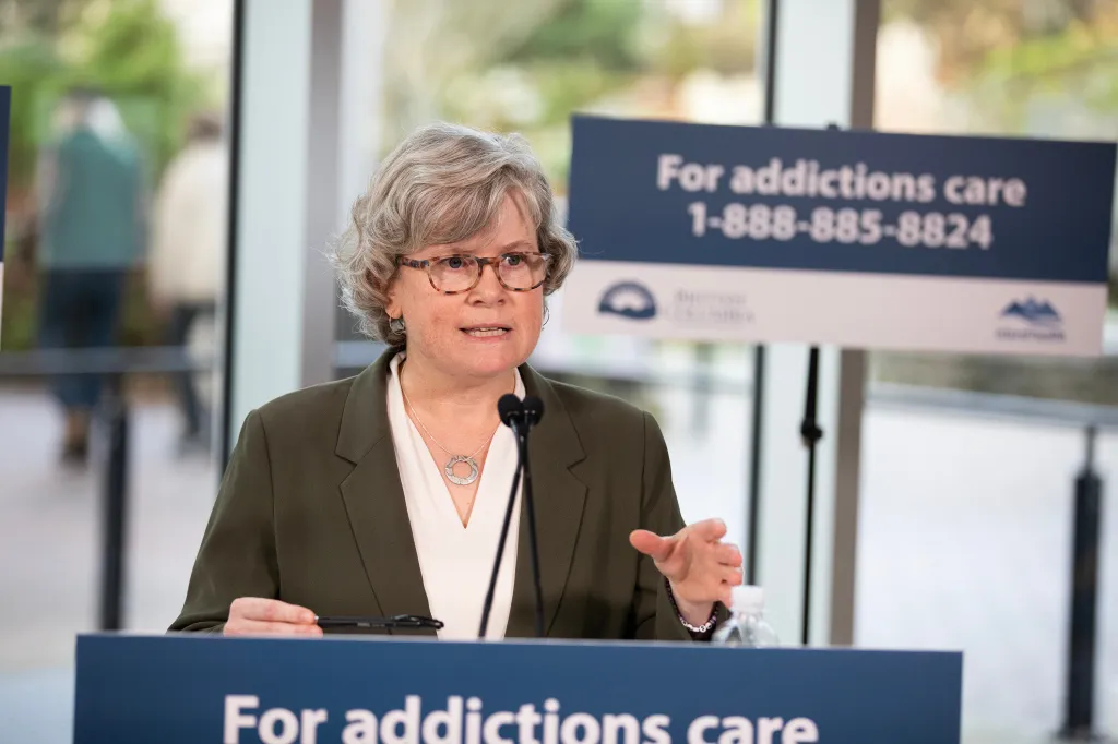 Josie Osborne speaking at a press conference about addiction care.