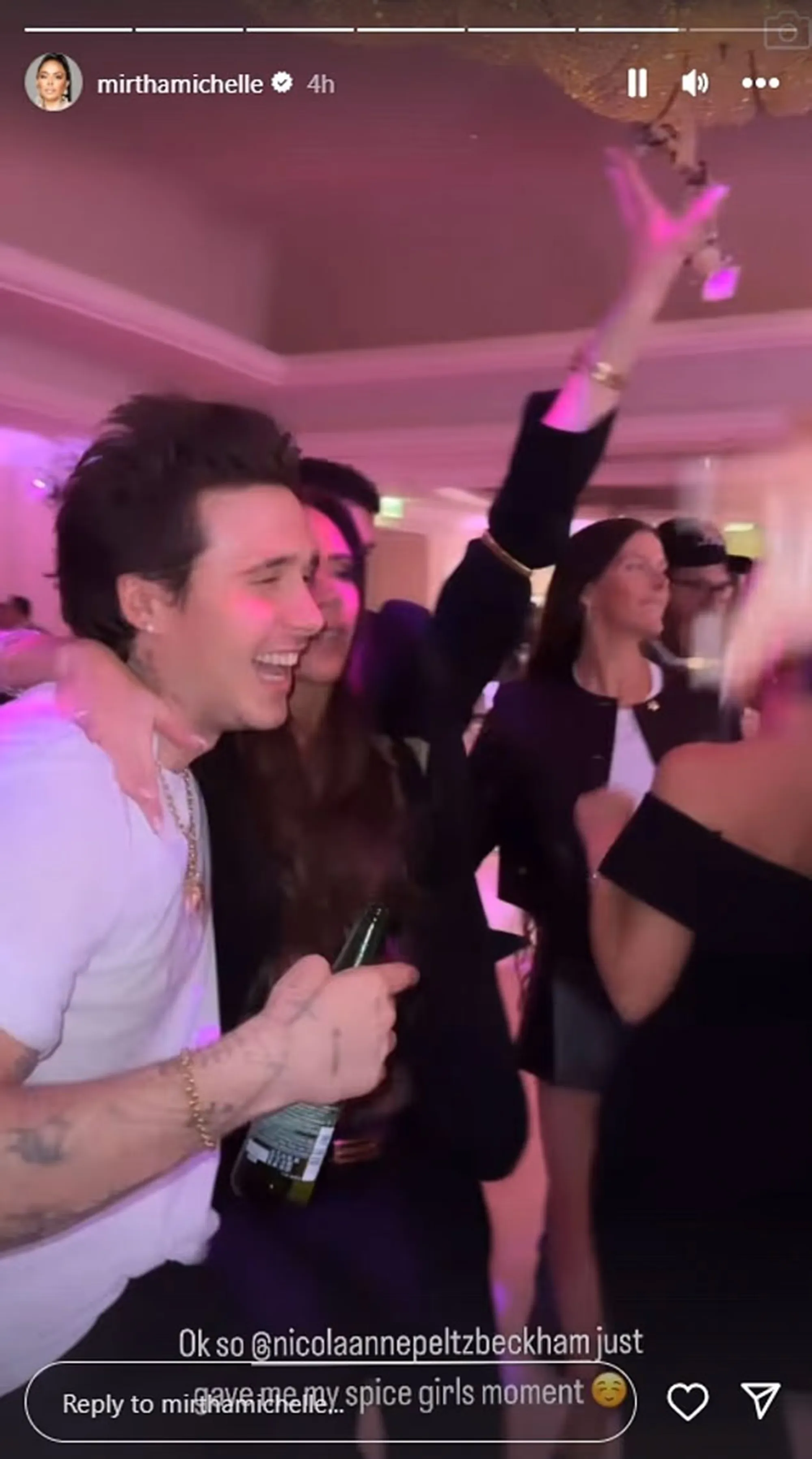 Brooklyn Beckham dancing with a drink in his hand at a party.