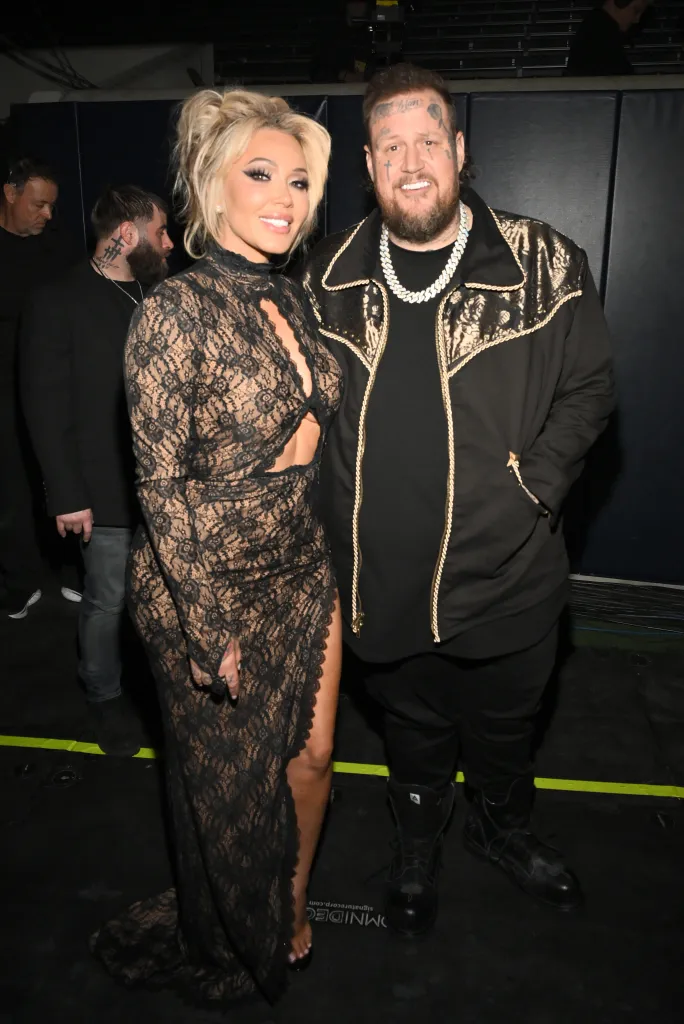 Bunnie Xo and Jelly Roll posing together at the 60th Academy of Country Music Awards.