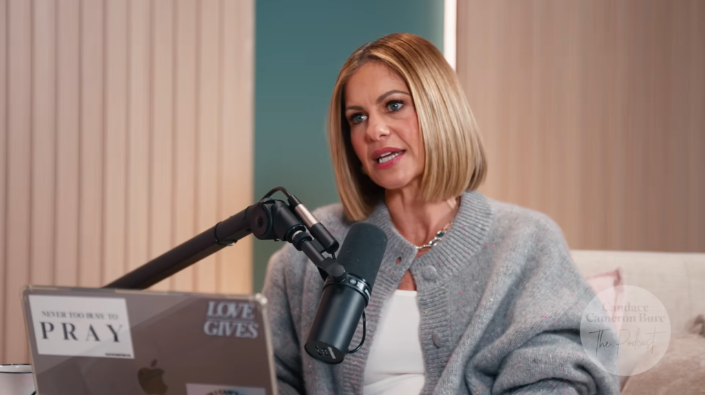 Candace Cameron Bure speaking into a microphone during a podcast recording.