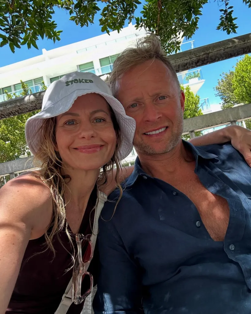 Candace Cameron Bure and Valeri Bure smiling for a selfie.