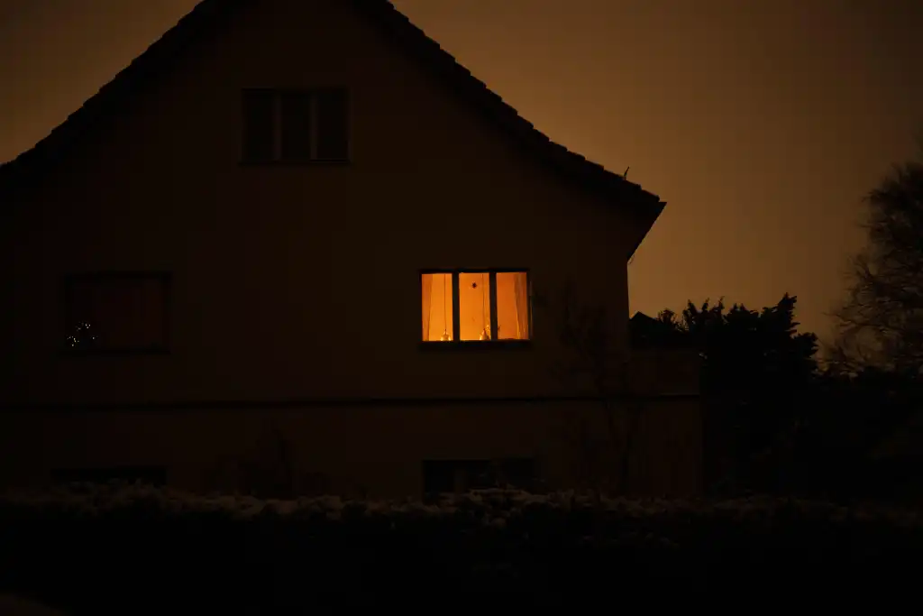 A house lit by candles during a power outage in Berlin, Germany on Jan. 4, 2026.