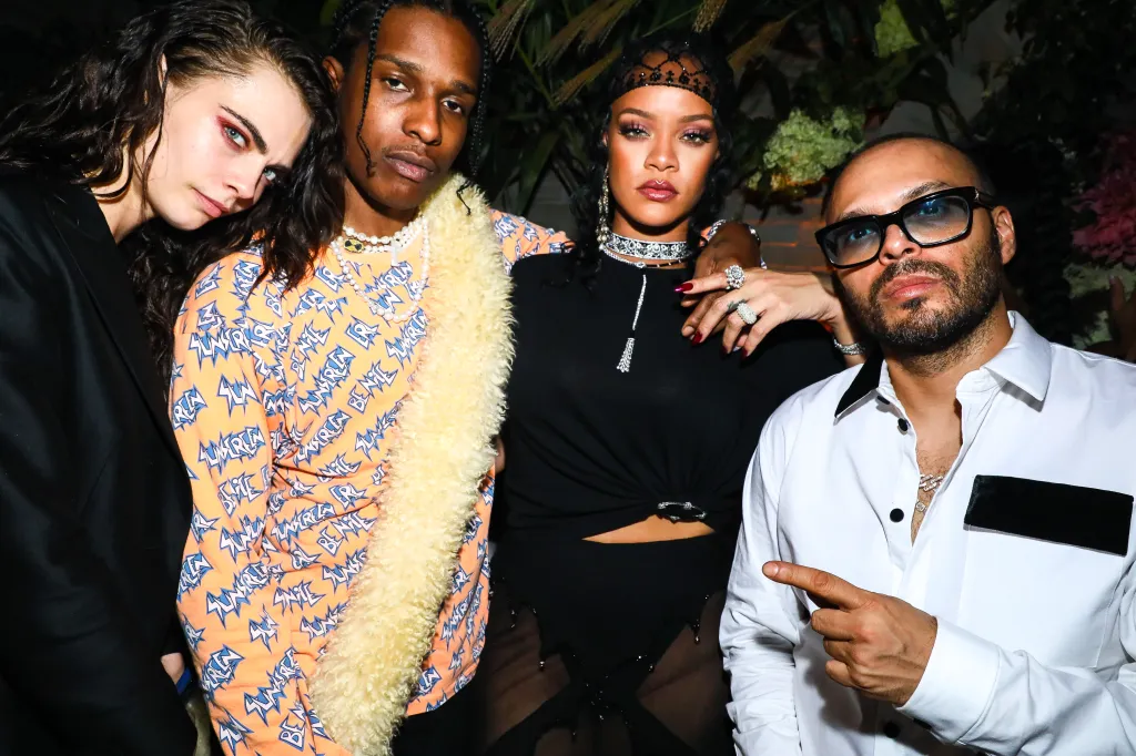 Cara Delevingne, A$AP Rocky, Rihanna, and Richie Akiva posing for a photo.