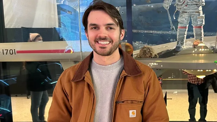 Charles Edward Littlejohn, an IRS contractor, smiles at the camera.