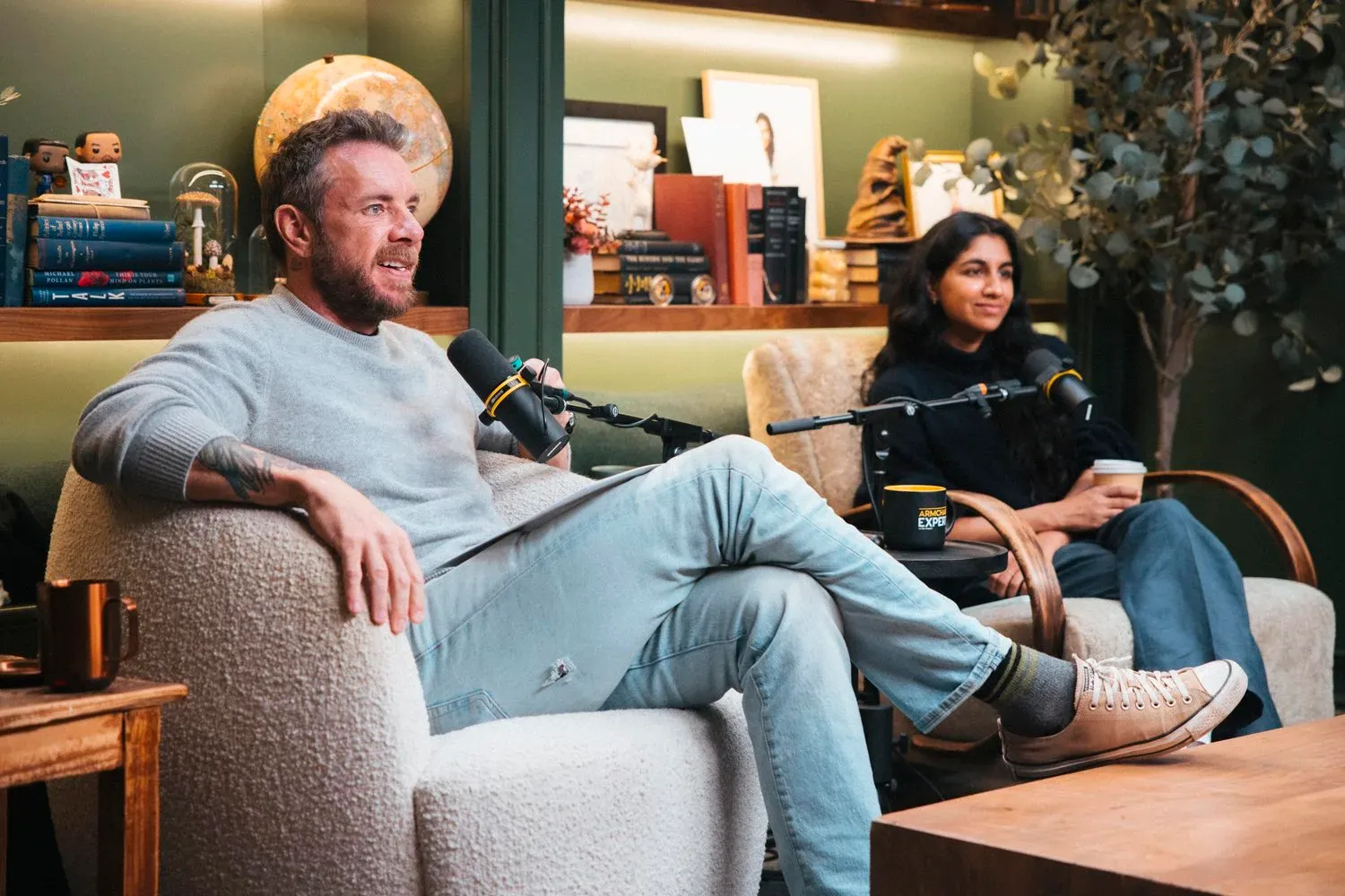 Dax Shepard and Monica Padman recording a podcast.