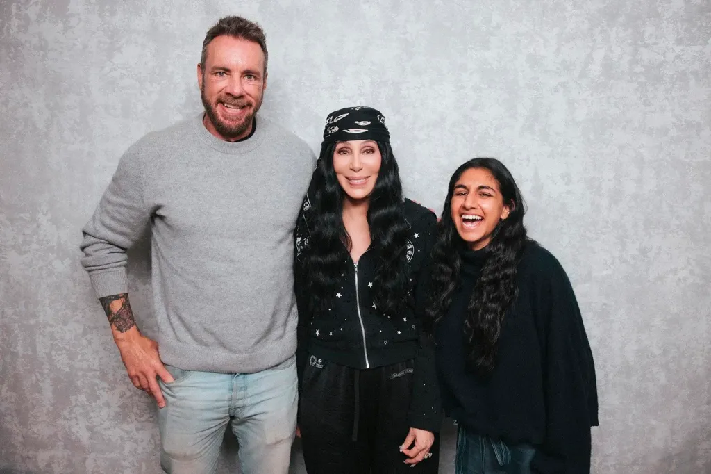 Dax Shepard, Cher, and Monica Padman smiling for a photo.