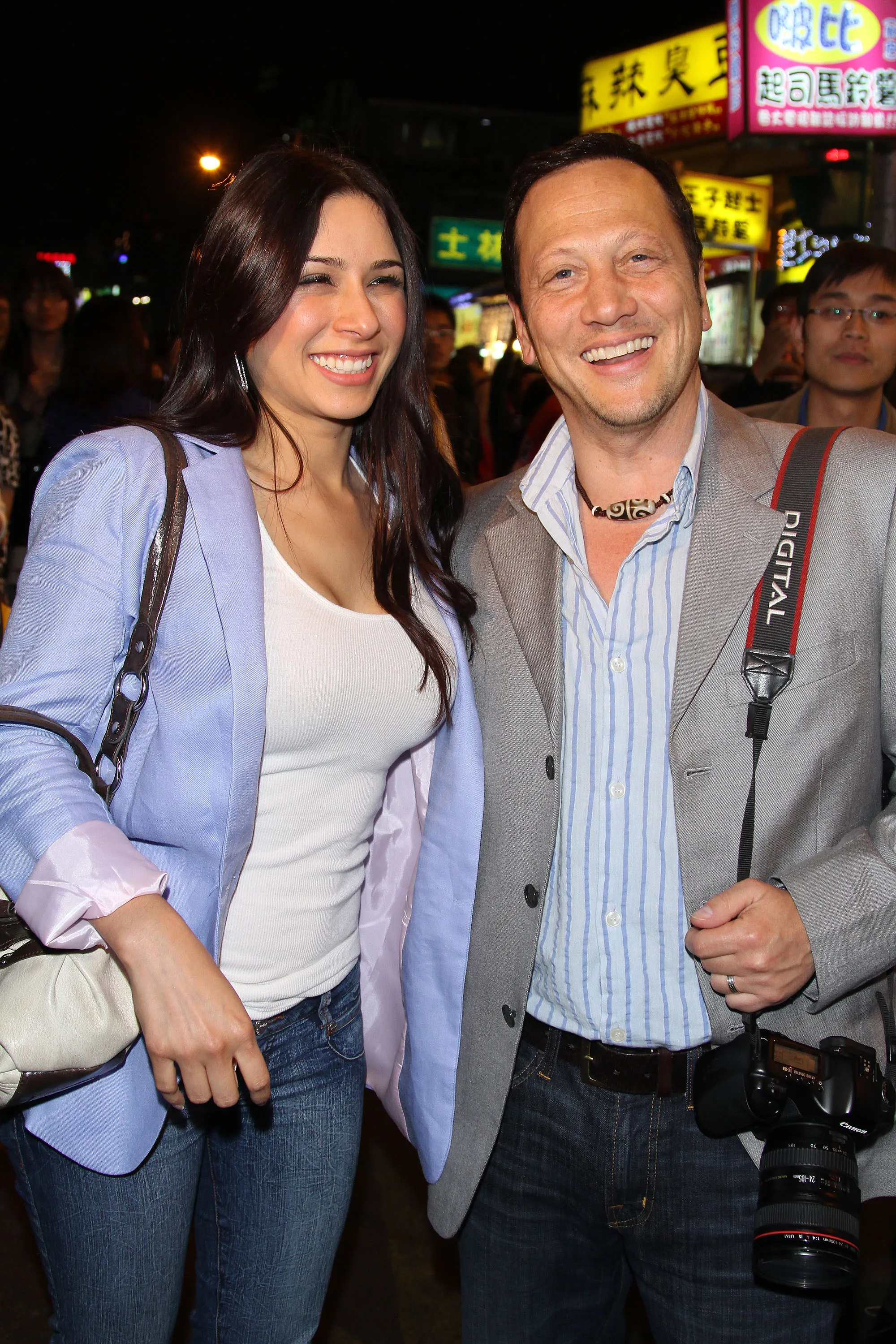 Actor Rob Schneider and his wife Patricia Azarcoya Arce smiling in Taipei, Taiwan.