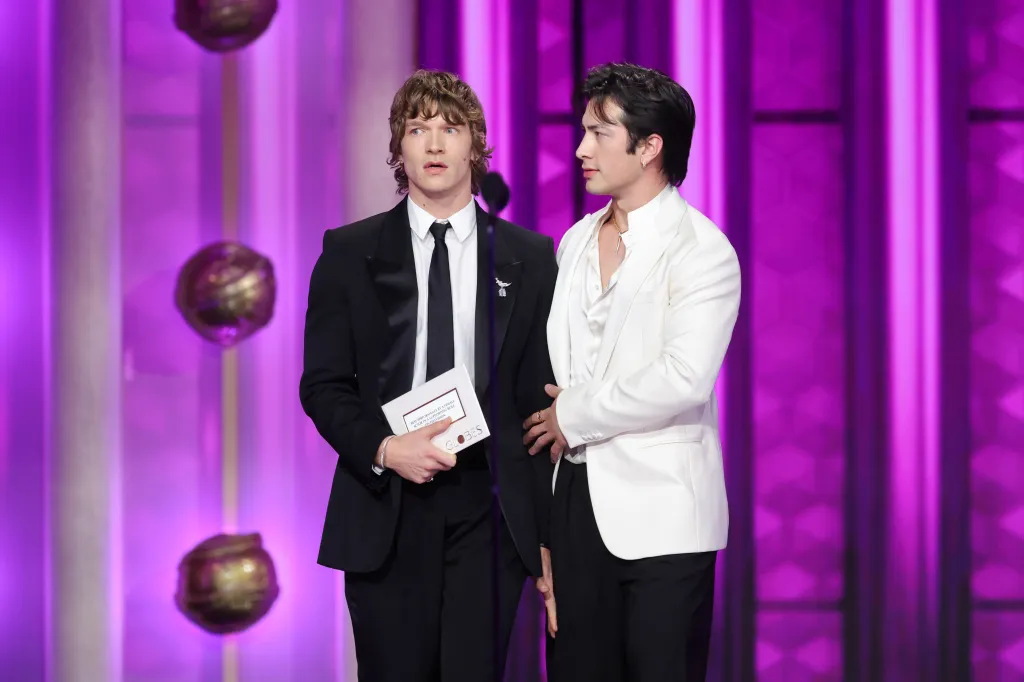 Connor Storrie and Hudson Williams onstage at the 83rd Annual Golden Globes.