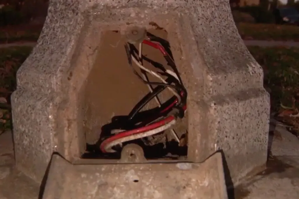 Exposed wiring from a street light after copper wire theft.