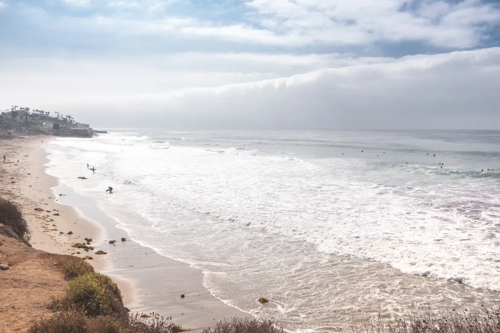 View of surfers on County Line Beach in Malibu, California.