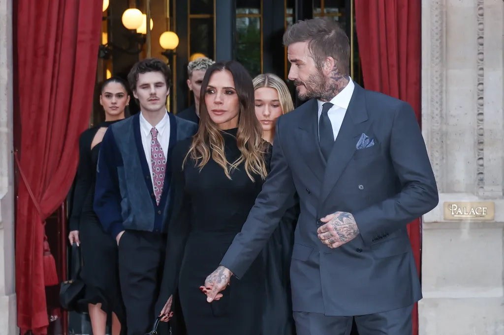 The Beckham family, including David and Victoria, leaving their hotel during Paris Fashion Week.