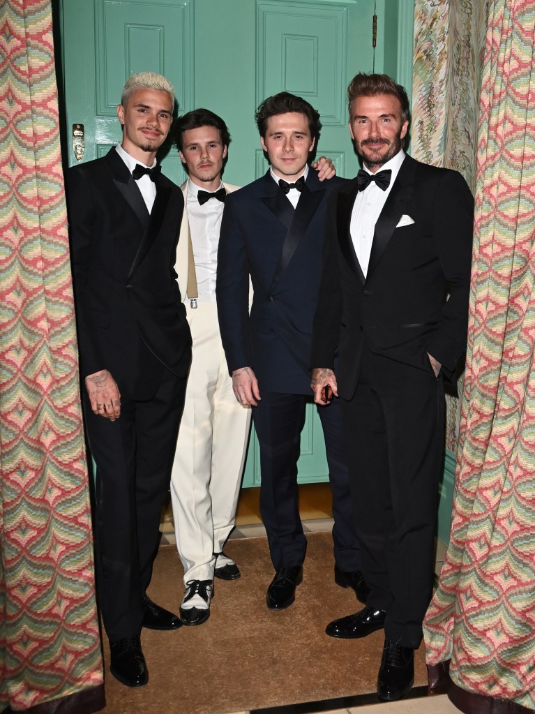 David Beckham, Brooklyn Beckham, Romeo Beckham, and Cruz Beckham in formal attire at Victoria Beckham's 50th birthday party.