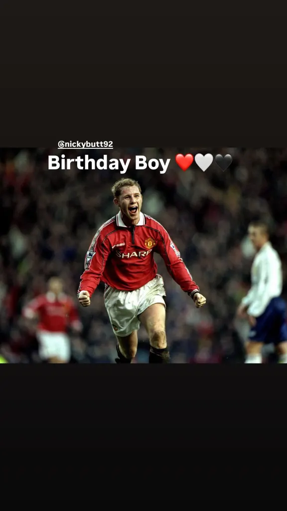 Nicky Butt in a red Manchester United jersey celebrating a goal.