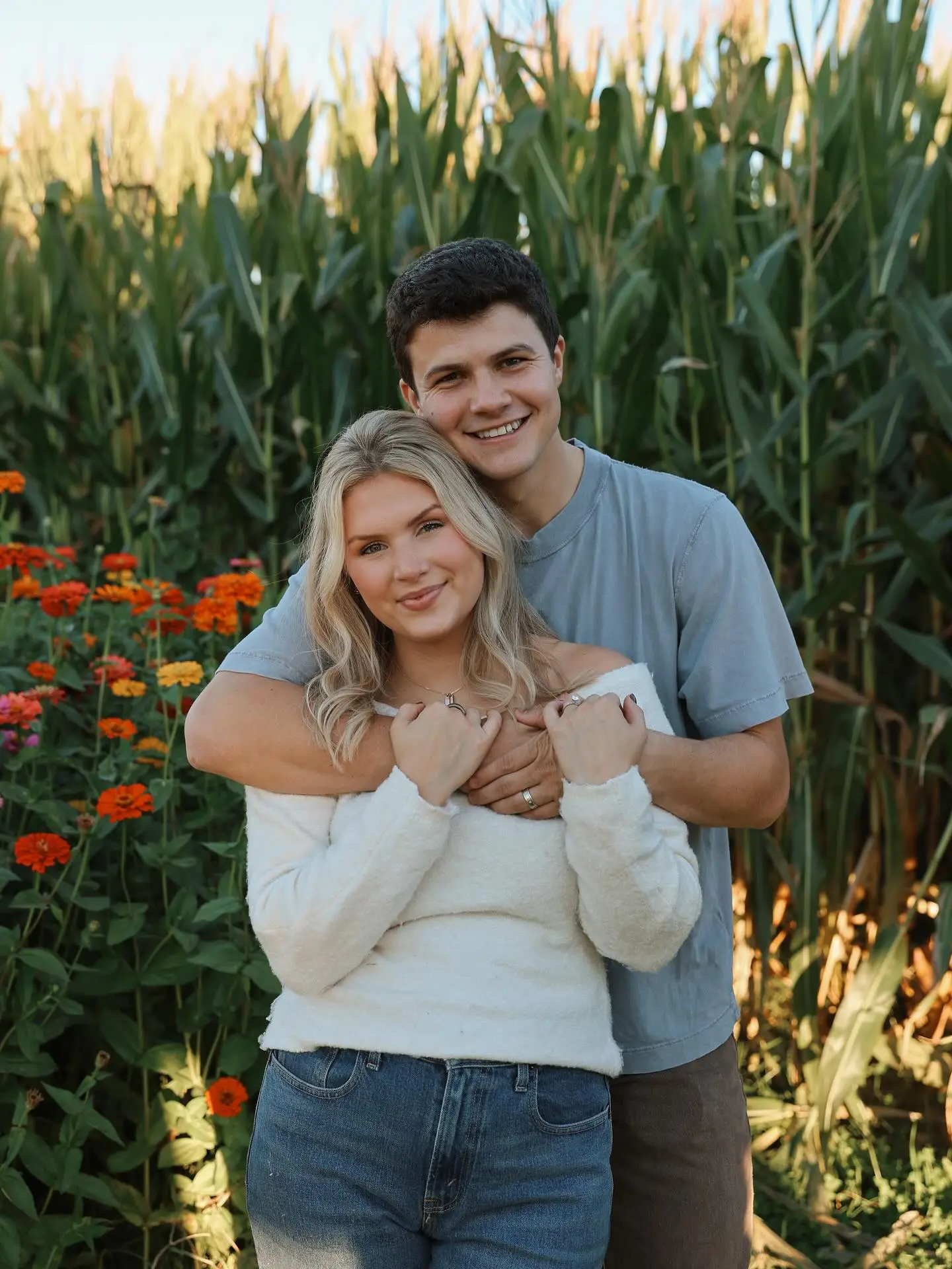 Katie Bates and Travis Clark in a pumpkin patch.