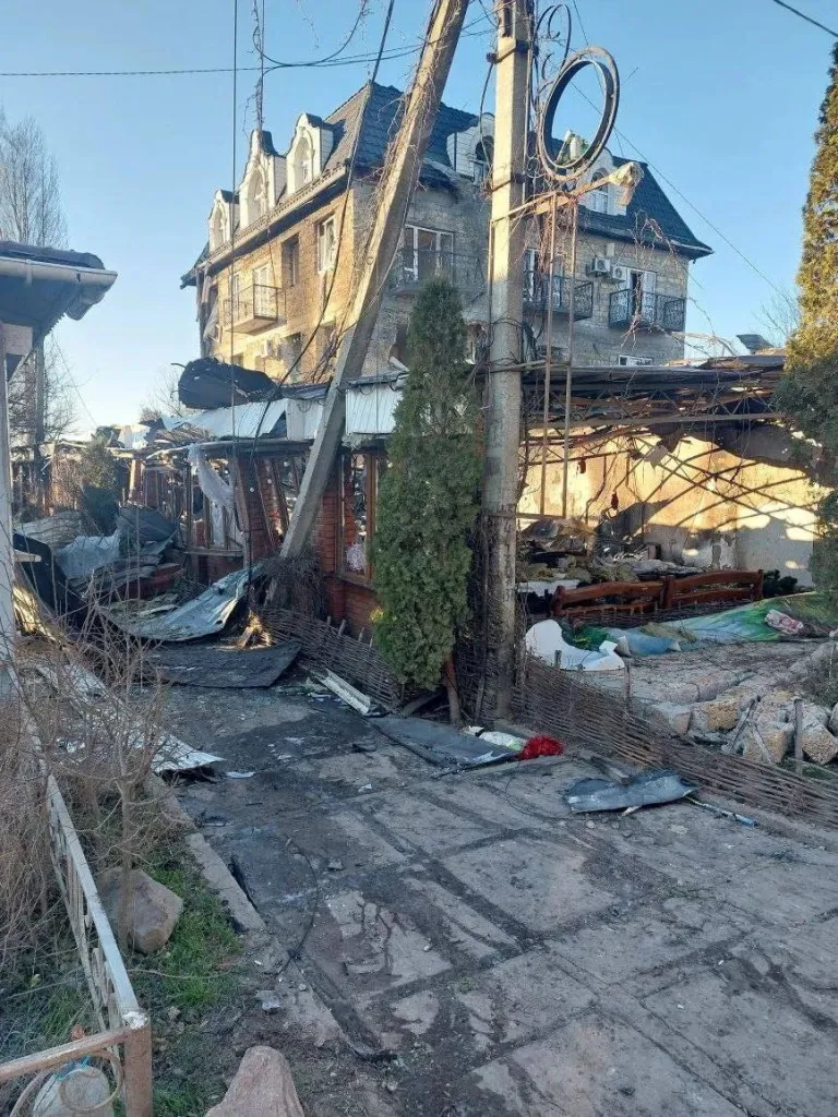 Debris on the ground near a destroyed building after a drone strike in Kherson Region.