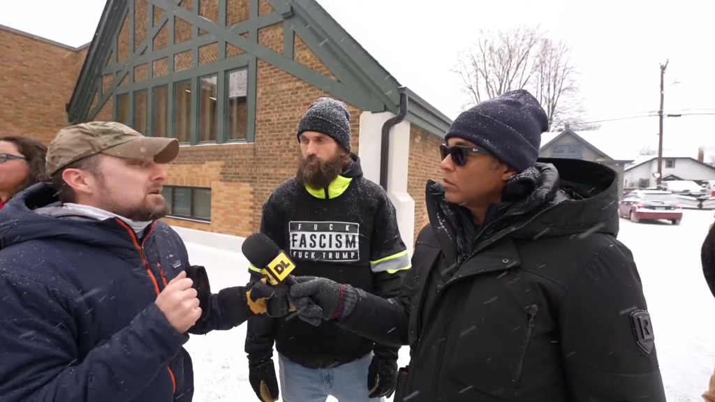 Don Lemon interviewing two men in the snow in Minneapolis.