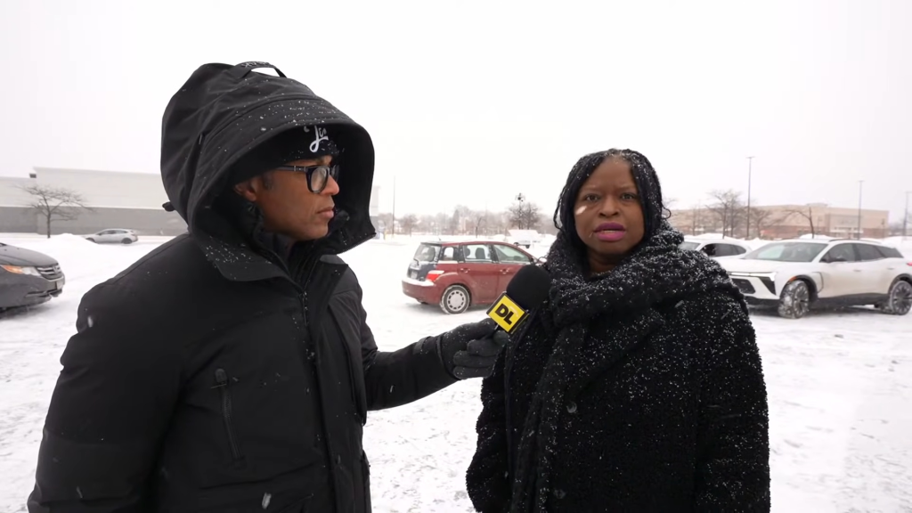Don Lemon reporting from Minneapolis in snowy conditions, holding a 