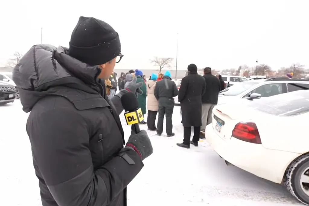 Don Lemon reporting live from Minneapolis, covered in snow, holding a microphone with a 