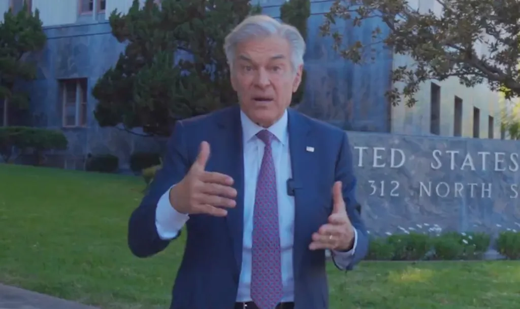 Dr. Oz standing in front of a building that says 