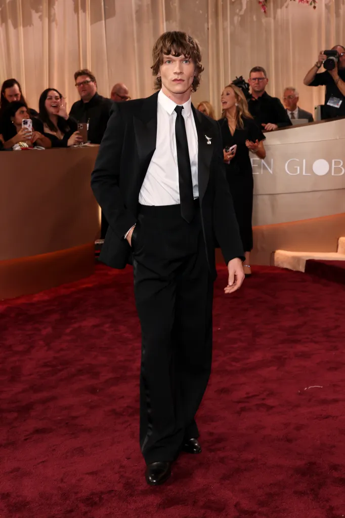 Connor Storrie walking on the red carpet at the 83rd Annual Golden Globe Awards.