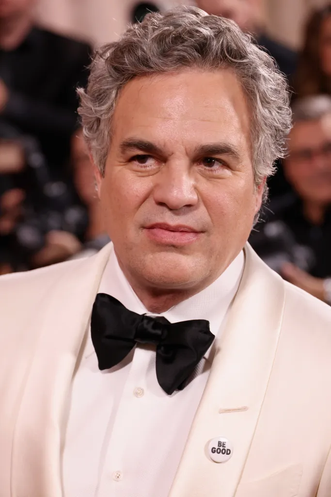 Mark Ruffalo wearing a white tuxedo jacket with a black bow tie and a 