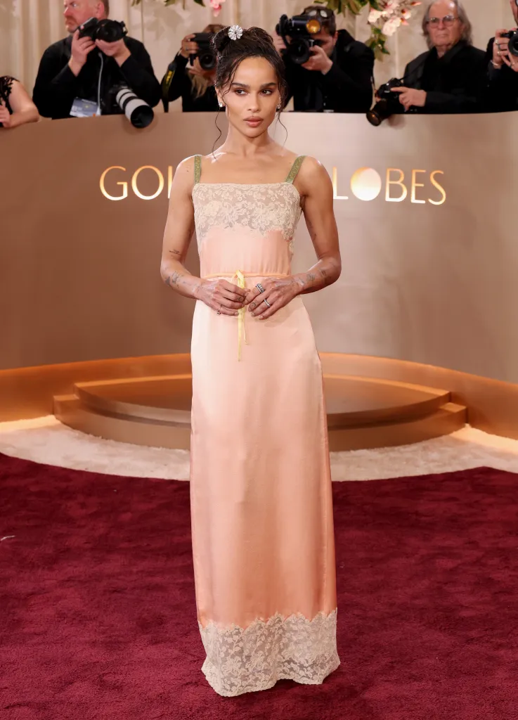 Zoë Kravitz in a light pink slip dress with lace details at the Golden Globe Awards.