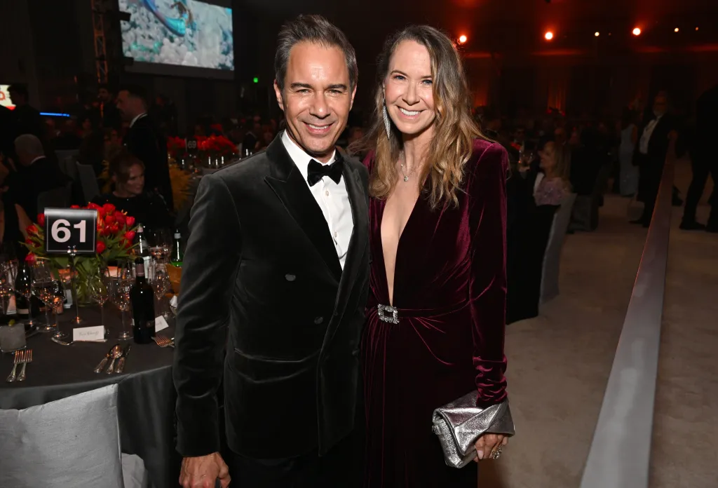 Eric McCormack and Janet McCormack pose for a photo at a formal event.