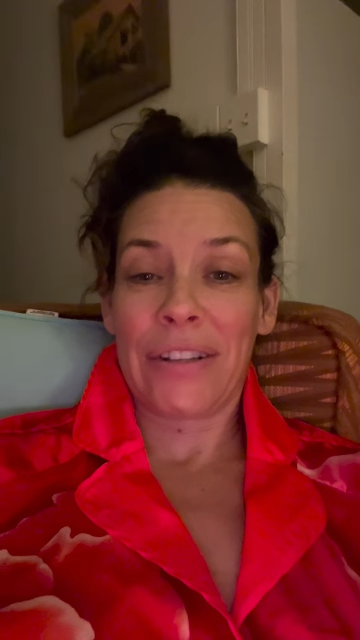Evangeline Lilly speaking to the camera in a red shirt.