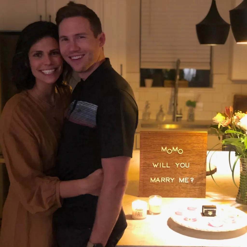 Spencer and Monique Tepe posing for a photo with a 