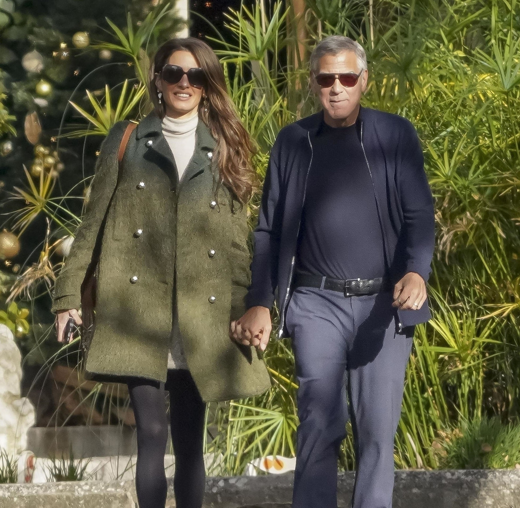 George and Amal Clooney walk hand-in-hand in the South of France.