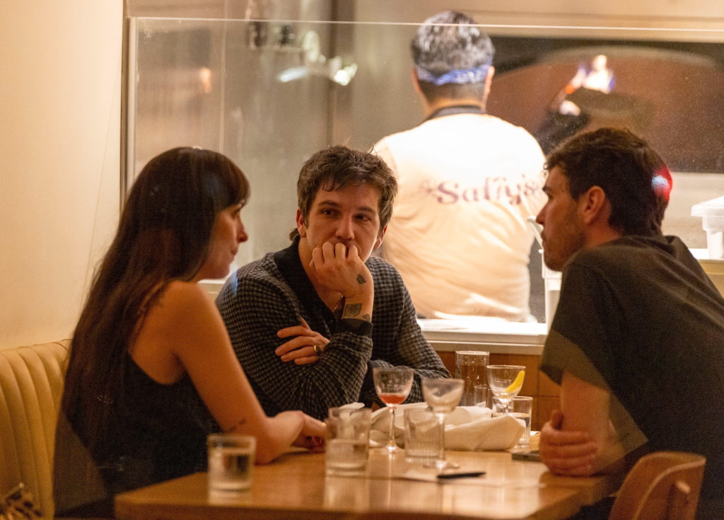 Dakota Johnson, Role Model, and a friend at a dinner outing in Los Angeles.