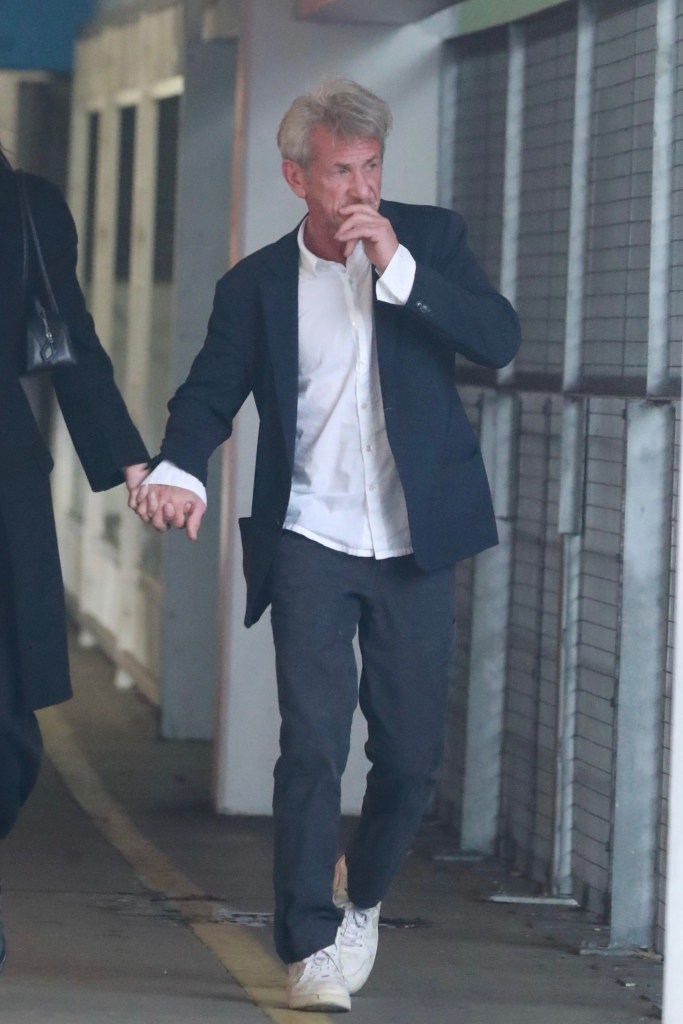 Sean Penn and Valeria Nicov holding hands during a shopping outing in Santa Monica.