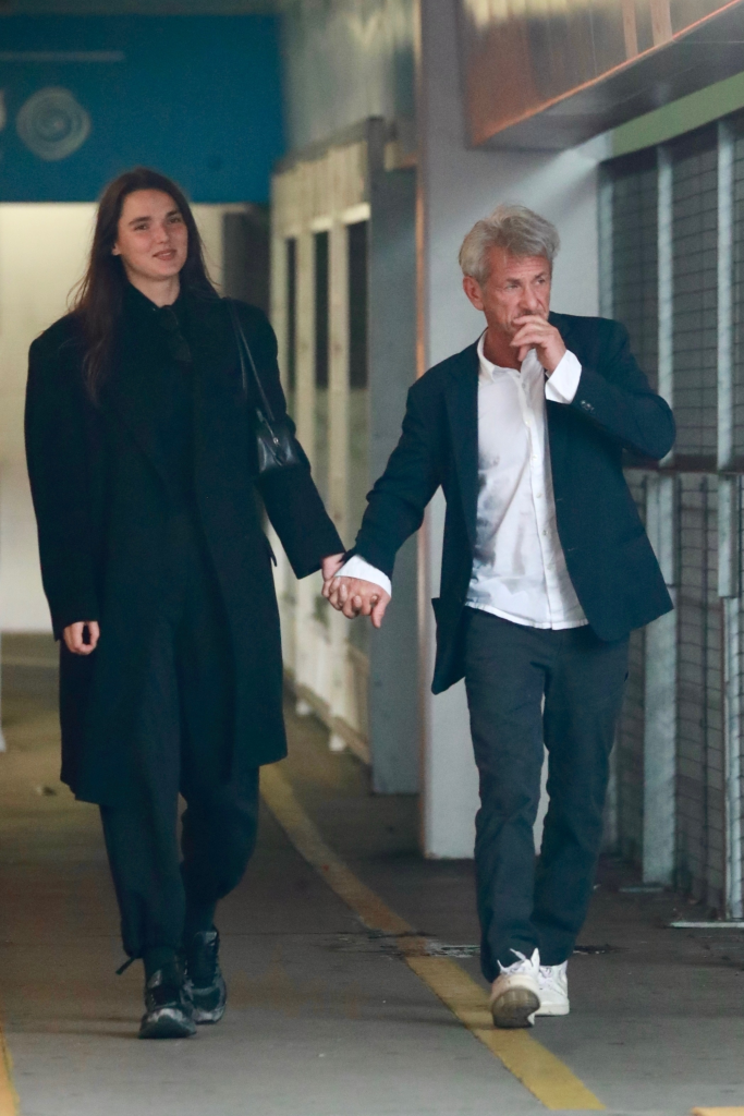 Sean Penn and Valeria Nicov holding hands during a shopping outing.