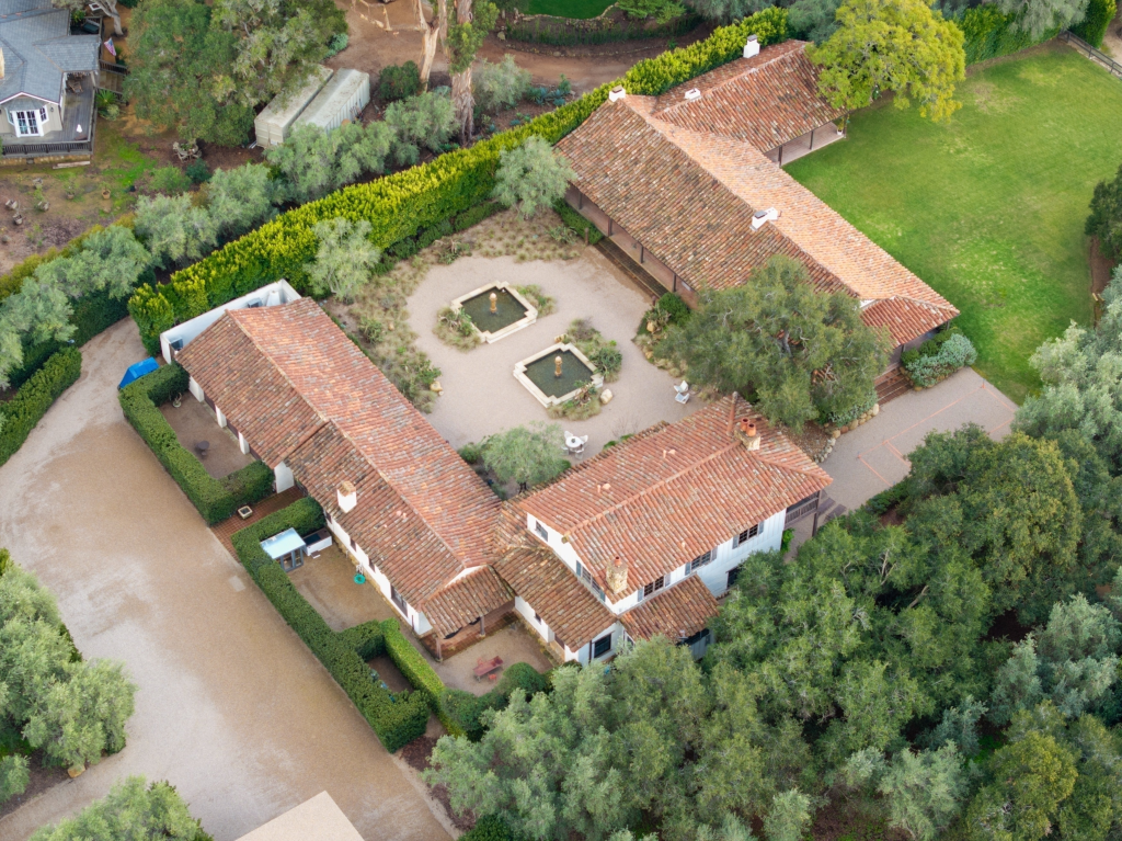 Aerial view of a sprawling Montecito estate with horse stables and training facilities.