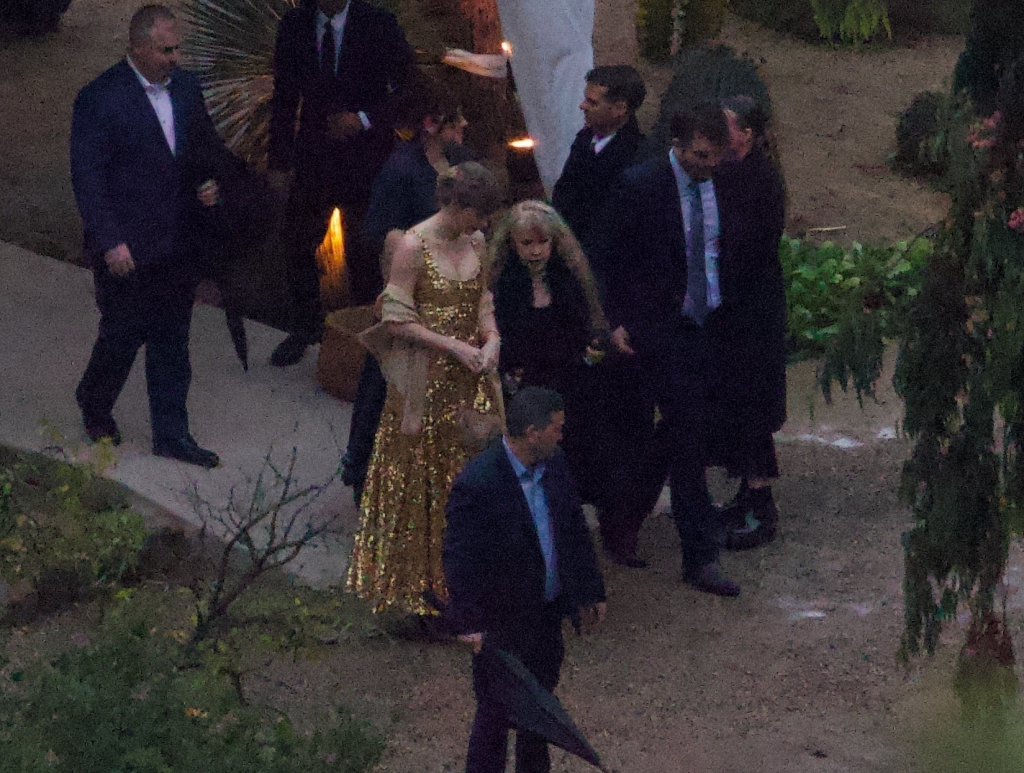 Taylor Swift, Stevie Nicks, and Este Haim among guests at a wedding.