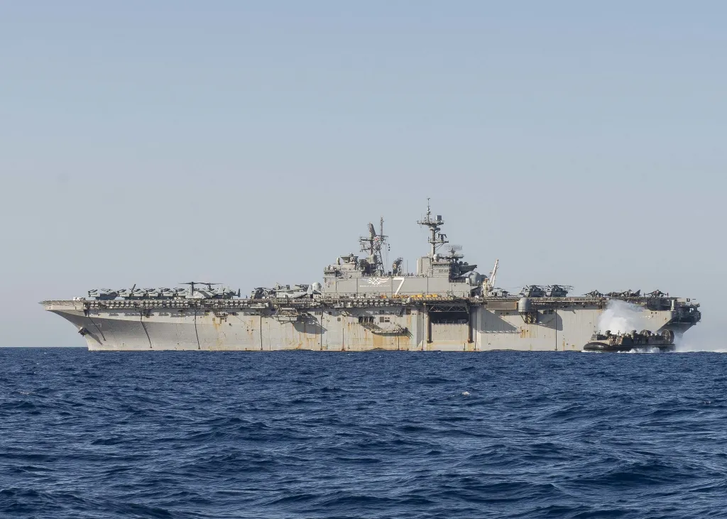 A landing craft air cushion exiting the deck of the USS Iwo Jima.