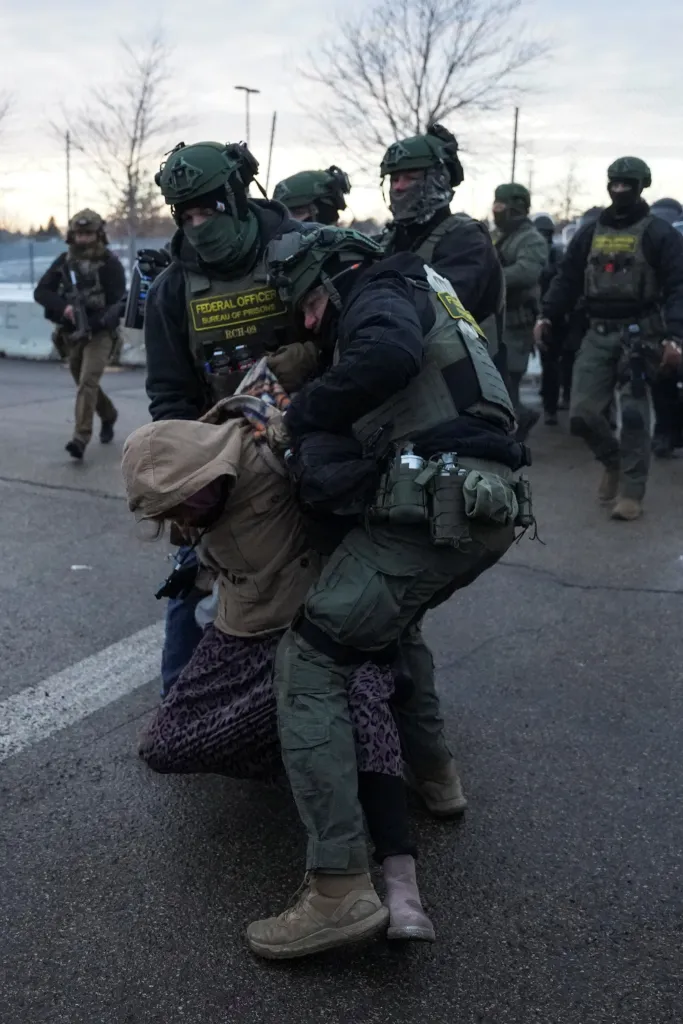 Federal agents detain a protester outside the Bishop Henry Whipple Federal Building in Minneapolis, Minnesota, on Jan. 17, 2026.