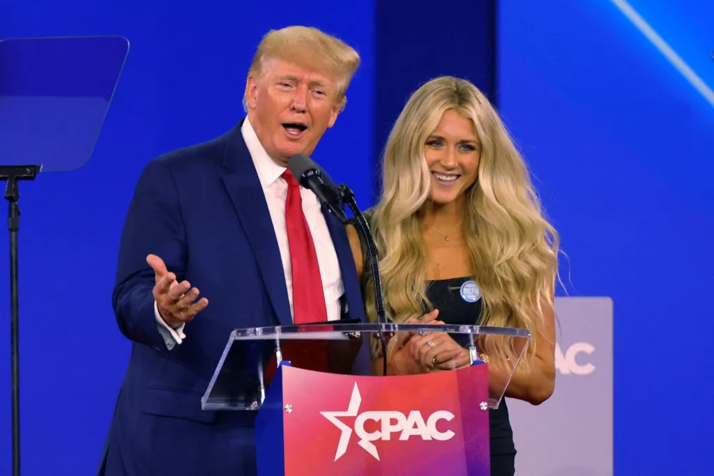 Former U.S. President Donald Trump and SEC champion swimmer Riley Gaines onstage at the Conservative Political Action Conference (CPAC).