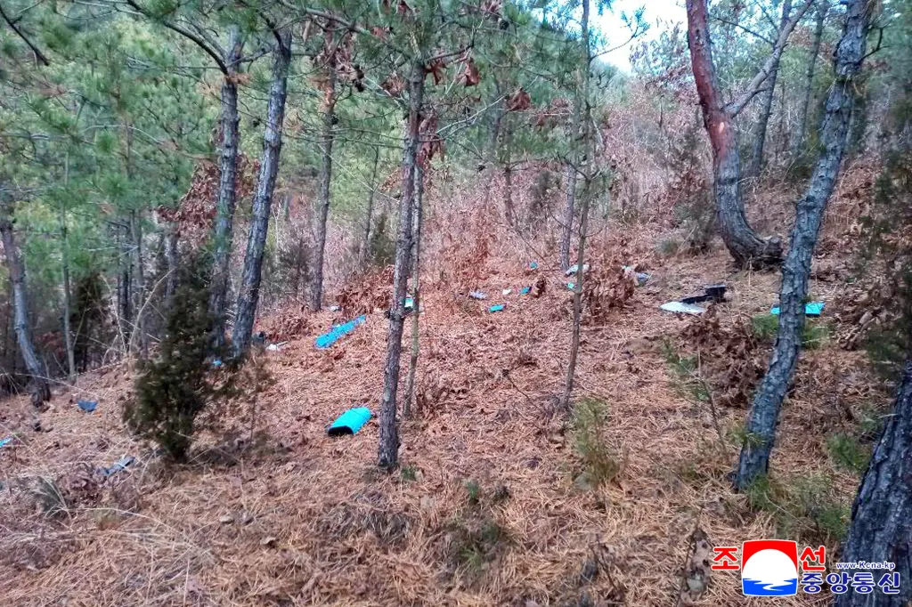 Fragments of a drone are scattered across the forest floor in Kaesong City, North Korea on Jan. 4, 2026. 