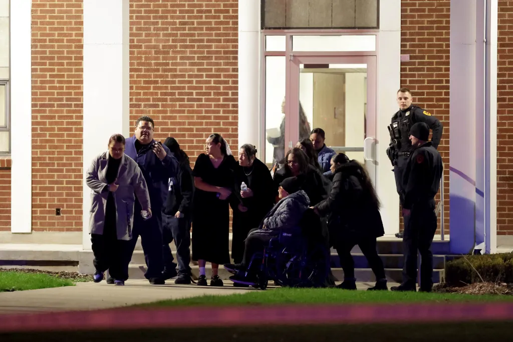 Funeral attendees walk out of the meetinghouse of The Church of Jesus Christ of Latter-day Saints on Jan. 7, 2026.