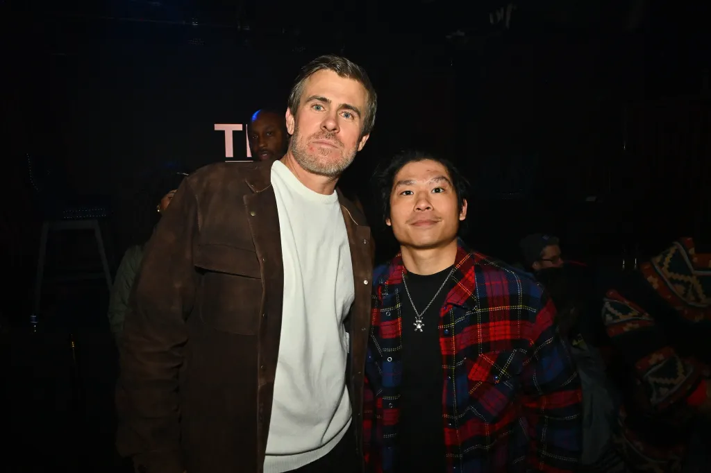 Garrett Patten and Pax Jolie-Pitt posing for a photo.