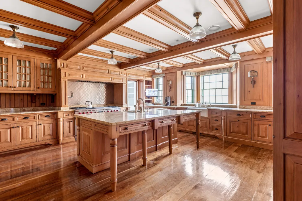 Wooden details extend into the large chef's kitchen.