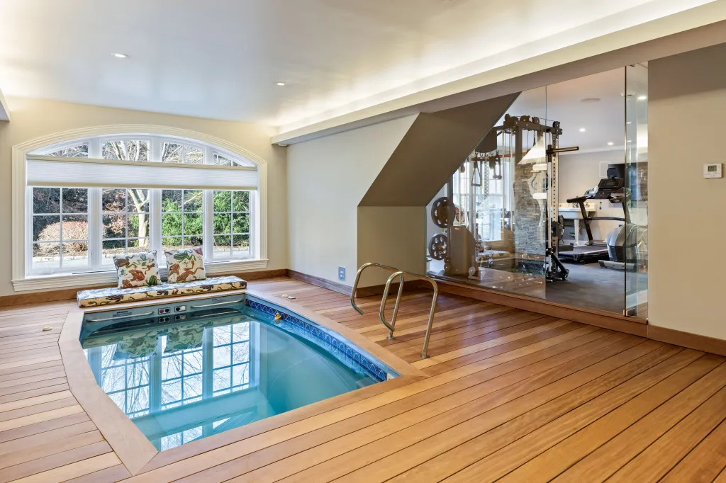 The indoor pool is located right next to the gym.